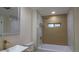 Modern bathroom featuring a new vanity, toilet, and bathtub with a shower at 2441 W 55Th Ave, Denver, CO 80221