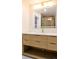 Bright bathroom boasts a modern vanity, quartz countertop, and illuminated mirror at 2441 W 55Th Ave, Denver, CO 80221