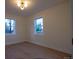 Bedroom features wood floors, neutral walls and two windows with natural light at 2441 W 55Th Ave, Denver, CO 80221