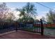 Wooden deck overlooking yard with wooden railing and landscaping at 2441 W 55Th Ave, Denver, CO 80221