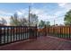 Enjoy outdoor living on this wood deck, with views of the surrounding yard at 2441 W 55Th Ave, Denver, CO 80221