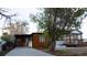Charming remodeled home has new siding, a covered carport, and front porch with fresh landscaping at 2441 W 55Th Ave, Denver, CO 80221