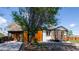 Charming home featuring a carport, covered front porch, and a well-maintained, landscaped yard at 2441 W 55Th Ave, Denver, CO 80221
