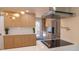 This gourmet kitchen features stainless appliances, modern lighting and lots of storage space at 2441 W 55Th Ave, Denver, CO 80221