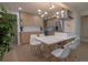 Bright, modern kitchen features sleek cabinetry, stainless appliances, and a stylish island with seating for casual dining at 2441 W 55Th Ave, Denver, CO 80221