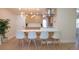 Bright kitchen featuring a modern island with barstool seating, stainless appliances and seamless flow at 2441 W 55Th Ave, Denver, CO 80221