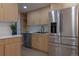 Modern kitchen with custom cabinets, stainless steel appliances, and elegant finishes at 2441 W 55Th Ave, Denver, CO 80221