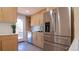 This kitchen features stainless appliances, sleek countertops, and ample cabinet space at 2441 W 55Th Ave, Denver, CO 80221