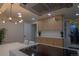 Modern kitchen with stainless steel appliances, quartz countertops, and stylish light fixtures at 2441 W 55Th Ave, Denver, CO 80221