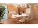 Bright, modern kitchen features sleek cabinetry, stainless appliances, and a stylish island with seating for casual dining at 2441 W 55Th Ave, Denver, CO 80221