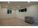 Bright living room features light wood floors, neutral walls, recessed lighting, and modern windows at 2441 W 55Th Ave, Denver, CO 80221