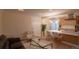 Open-concept living area showcasing the modern kitchen, dining space, and comfortable seating area at 2441 W 55Th Ave, Denver, CO 80221