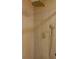 Close up of modern shower featuring gold hardware and horizontal tiles at 2441 W 55Th Ave, Denver, CO 80221