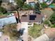 Aerial view of the property showing solar panels, a well-maintained lawn, and the surrounding neighborhood at 4383 S Eagle Cir, Aurora, CO 80015