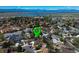 Aerial view featuring a green location pin, showcasing the property and its proximity to the lake and mountains at 4383 S Eagle Cir, Aurora, CO 80015