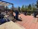 Brick patio showcasing ample seating and garden containers at 4383 S Eagle Cir, Aurora, CO 80015
