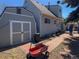 Backyard featuring a shed and a brick patio with direct access to the house at 4383 S Eagle Cir, Aurora, CO 80015