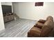 Finished basement with vinyl flooring, entertainment center, and theater seating at 4383 S Eagle Cir, Aurora, CO 80015