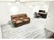 Spacious basement featuring modern vinyl floors and an office area at 4383 S Eagle Cir, Aurora, CO 80015