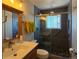 Updated bathroom featuring tiled shower with glass doors, and a modern vanity at 4383 S Eagle Cir, Aurora, CO 80015