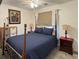 Cozy bedroom with a large bed, bedside tables, and a stylish carpet at 4383 S Eagle Cir, Aurora, CO 80015