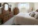 Bright bedroom with natural light and carpet, and vintage furnishings at 4383 S Eagle Cir, Aurora, CO 80015