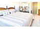 Comfortable bedroom with neutral tones, a mirror and a plush bed at 4383 S Eagle Cir, Aurora, CO 80015