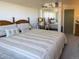 Bedroom featuring carpet and striped bedding, and a mirrored closet at 4383 S Eagle Cir, Aurora, CO 80015