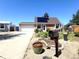 Charming single-Gathering home featuring a well-manicured front yard and solar panels on the roof at 4383 S Eagle Cir, Aurora, CO 80015