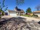 Bright house with solar panels and garage with driveway at 4383 S Eagle Cir, Aurora, CO 80015