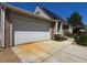Front exterior view of home with attached garage and solar panels on the roof at 4383 S Eagle Cir, Aurora, CO 80015