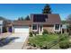 Charming home with a well-kept lawn, mature trees, and a two-car garage enhancing curb appeal at 4383 S Eagle Cir, Aurora, CO 80015