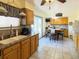 Bright kitchen with tile flooring, stainless steel appliances, and access to the backyard at 4383 S Eagle Cir, Aurora, CO 80015