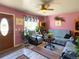 Cozy living room with beautiful plants, patterned rugs, and a ceiling fan at 4383 S Eagle Cir, Aurora, CO 80015
