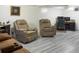 Spacious living room featuring reclining chairs and room for activities at 4383 S Eagle Cir, Aurora, CO 80015
