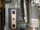 Utility room featuring an American Standard furnace and Rheem water heater at 4383 S Eagle Cir, Aurora, CO 80015