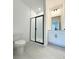 Modern bathroom with a glass-enclosed shower, vanity and contemporary fixtures at 9662 Browns Peak Cir, Littleton, CO 80125