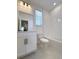 Full bathroom featuring a tub shower, a vanity with storage and a tile backsplash at 9662 Browns Peak Cir, Littleton, CO 80125