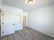 A cozy bedroom featuring neutral walls, light-colored floors and a closet at 9662 Browns Peak Cir, Littleton, CO 80125