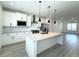 Modern kitchen featuring granite countertops, stainless appliances, and pendant lights at 9662 Browns Peak Cir, Littleton, CO 80125