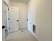 Bright laundry room with tile flooring and utility hookups, ready for modern appliances at 9662 Browns Peak Cir, Littleton, CO 80125