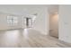 Bright and open living room area with hardwood floors, staircase, and modern finishes at 9662 Browns Peak Cir, Littleton, CO 80125
