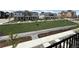 Picture from a balcony overlooking the landscaped street of a home community at 9662 Browns Peak Cir, Littleton, CO 80125