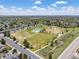 Expansive aerial view showcasing the neighborhood and a large community park with green space at 1148 S Ventura Cir # C, Aurora, CO 80017