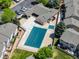 Aerial view of a community pool covered for the off-season, surrounded by condominiums and green space at 1148 S Ventura Cir # C, Aurora, CO 80017