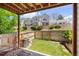 A fenced backyard space with well-kept lawn and mature shrubs, creating a cozy outdoor area at 1148 S Ventura Cir # C, Aurora, CO 80017
