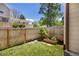 Private backyard with grass area and garden bed, fenced for privacy and relaxation at 1148 S Ventura Cir # C, Aurora, CO 80017