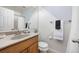 Well-lit bathroom with a stylish vanity, neutral tones, and modern fixtures at 1148 S Ventura Cir # C, Aurora, CO 80017