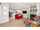 Bright living room featuring a cozy fireplace, hardwood floors, and an open floor plan at 1148 S Ventura Cir # C, Aurora, CO 80017