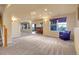Spacious basement with a seating area and bar at 2485 Greensborough Cir, Highlands Ranch, CO 80129